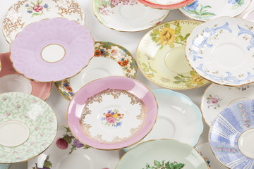 Beautiful vintage tea cups and saucers collection, isolated on a white background.