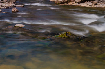 Background of Carpathian mountain river with long exposure