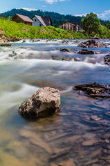 Background of Carpathian mountain river with long exposure