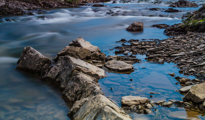 Background of Carpathian mountain river with long exposure