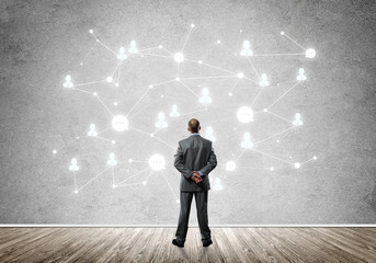 Fototapeta premium Connection lines drawn on concrete wall as symbol for networking