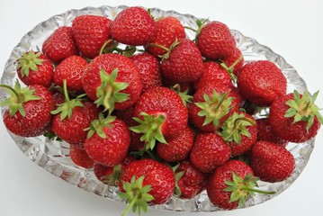 Still life, the crystal vase filled with strawberry