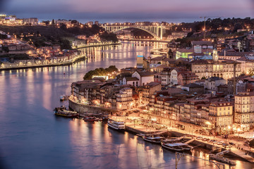 Porto, Portugal: aerial view of the old town and Douro river at night
