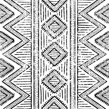 Seamless geometric pattern. Print for your textile. Ethnic and tribal motifs. Black and white ornament. Grungy texture.