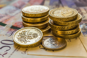 British coins stack on black, pound sterling