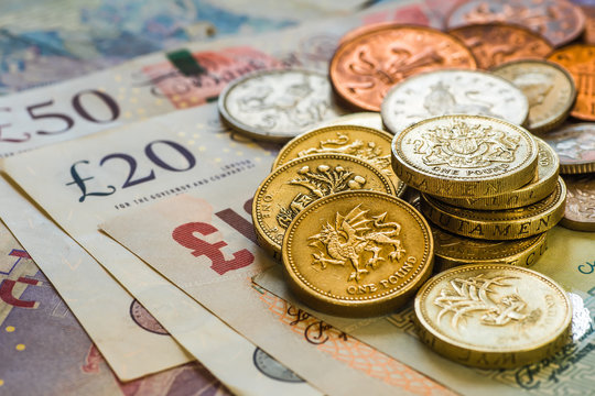 British coins stack on black, pound sterling