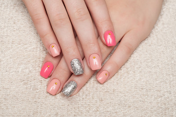 Pink, beige manicure. Sparkles, crystals on nails, yellow rhinestones. Year manicure on long square nails. 