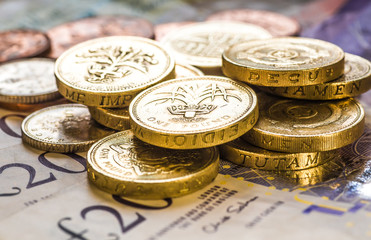 British coins stack on black, pound sterling