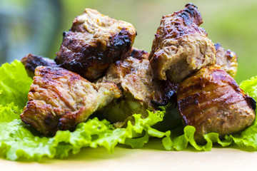 Pork shish kebab on a wooden table