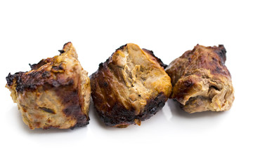 Grilled shish kebab or shashlik on skewers closeup on white background