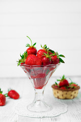 Ripe strawberries on wooden table. Fresh strawberries on wooden background