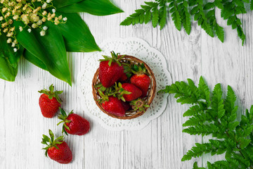 Ripe strawberries on wooden table. Fresh strawberries on wooden background