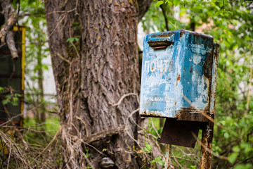 decayed blue ukrainian mailbox in Prypjat