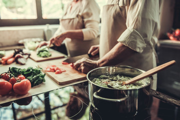 Old couple in kitchen