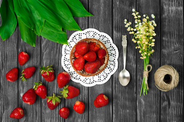 Ripe strawberries on wooden table. Fresh strawberries on wooden background