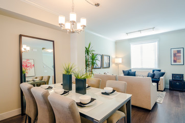 Modern bright dining room with a living room in a luxury apartment. Interior design.