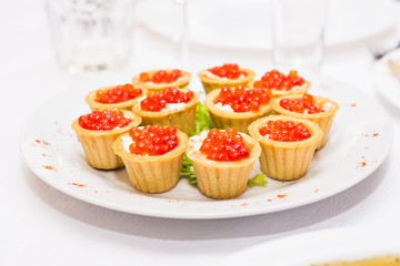 Tartlets with red caviar. Protein healthy food