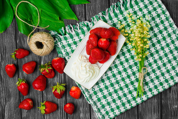 Ripe strawberries on wooden table. Fresh strawberries on wooden background
