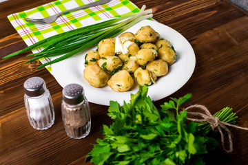 New Potatoes topped with chopped onion and sausage.