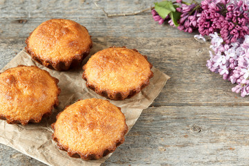 Some cupcakes in the baking dish on a dark background