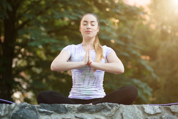 Woman on a mat relaxing outdoor