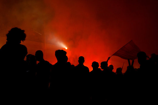 Silhouettes Of Protesters