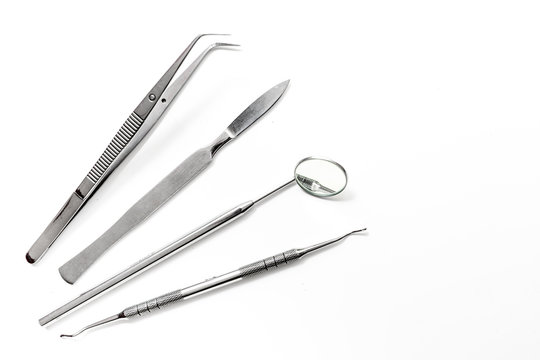 dentist tools close up on white hospital desk background top view mockup