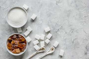 variety of sugar in bowls on gray table background top view space for text