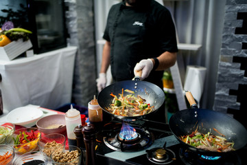 chinese food being prepared on a stove