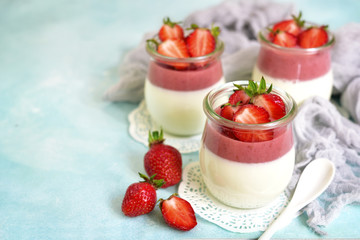 Vanilla strawberry panna cotta in a vintage jars.Copy space.