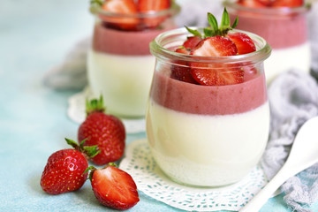Vanilla strawberry panna cotta in a vintage jars.