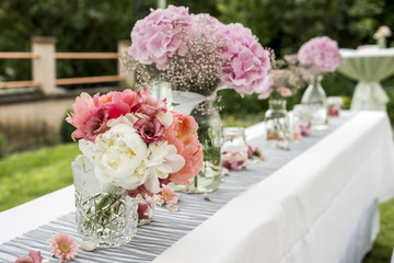 flowers settings decoration outdoor setup for wedding with pink colored flower