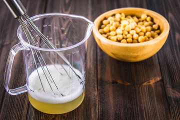 Chickpea liquid water brine draining. Vegan Aquafaba