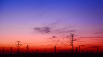 Fototapeta premium High voltage towers, silhouette in the evening