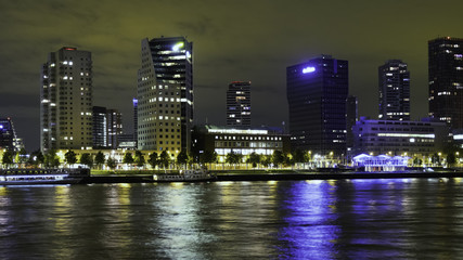 Fototapeta na wymiar Rotterdam, The Netherlands - May 2017: Boompjeskade at night from the island Noordereiland