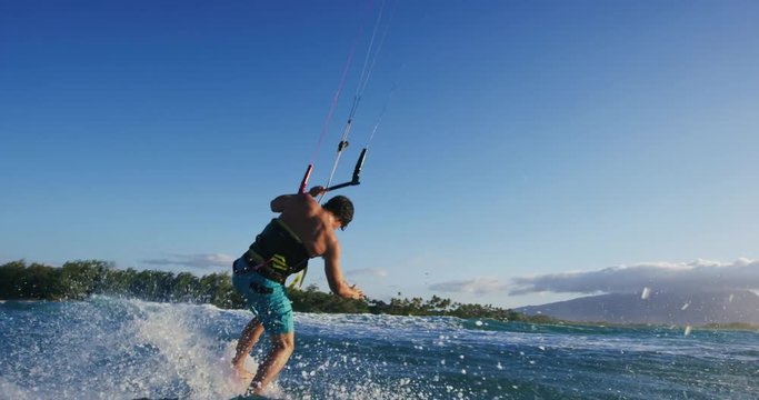 Young Man Kite Surfing in Slow Motion Catching Air on Surfboard