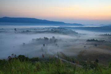 Fototapeta na wymiar Fog in morning sunrise and road at Khao Takhian Ngo View Point at Khao-kho Phetchabun,Thailand