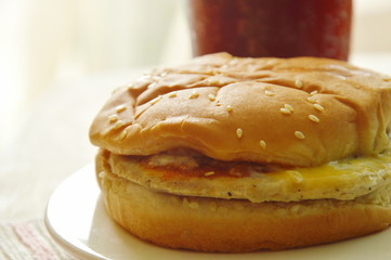 chicken hamburger and cola with ice in plastic cup