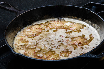 Skillet of hot boiling oil for frying