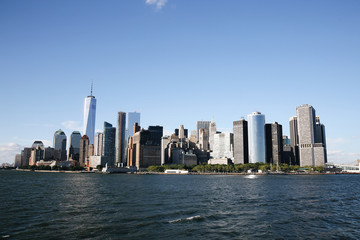 Fototapeta na wymiar Manhattan skyline. Boat ride on Hudson river. Sunny summer day. Travel, vacation, sightseeing, New York, tourism, and urban living concept