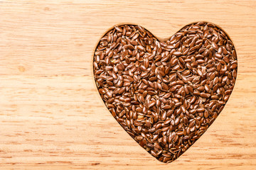 Raw flax seeds linseed heart shaped