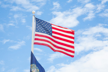 American flag with blue sky in boston.