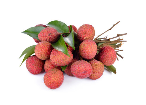 bunch of fresh Lychees with leaves and stem on white background