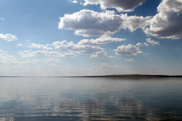 the sky reflected in the water, deserted beach lake, summer sky, nature, blue cloud,