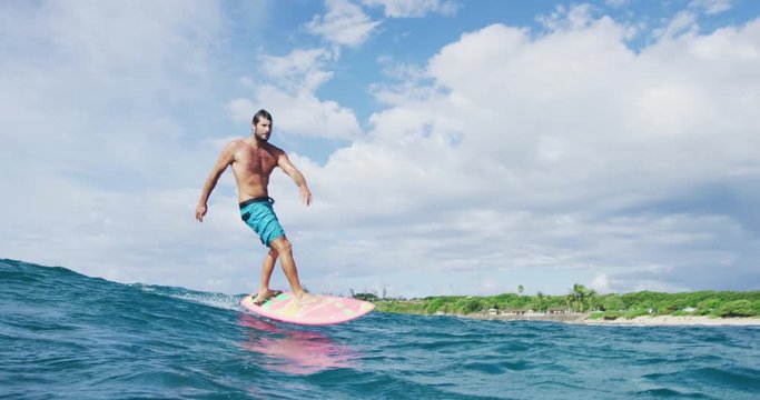 Surfer on hydrofoil surfboard riding blue ocean wave. Futuristic surfing on hoverboard