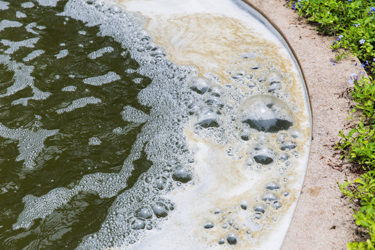 oxygen bubble in dirty sewage water treatment in factory pond.