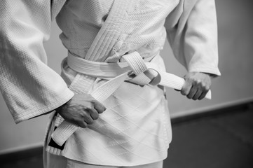 Young girl dressed in hakama practicing Aikido