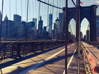 Fototapeta premium Walkway of Brooklyn bridge and buildings at Manhattan in vintage style, New York