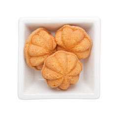 Southeast Asian pastry - Kueh buloh in a square bowl isolated on white background
