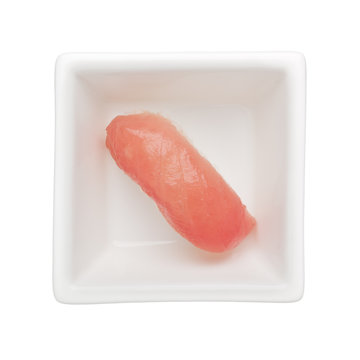 Maguro nigiri in a square bowl isolated on white background